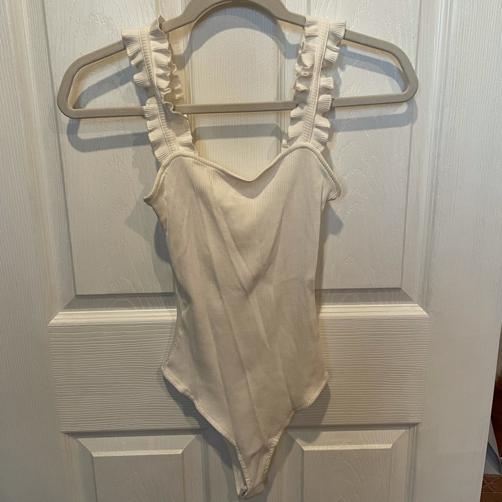 White ruffle bodysuit
